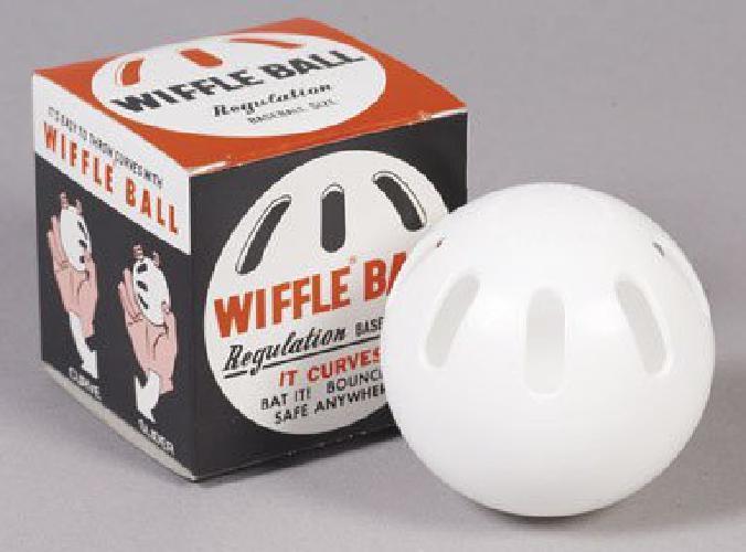 One Dozen Baseball Sized Wiffle Balls In A Countertop Display By Wiffle 